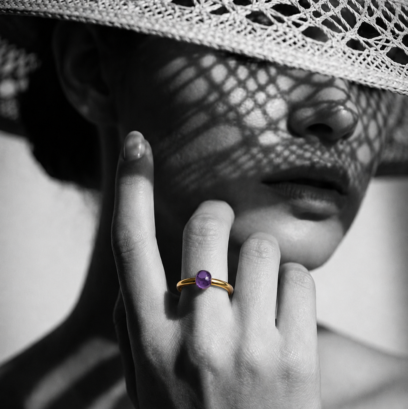 Woman wearing a purple gemstone ring in a black-and-white Matanee jewelry editorial.