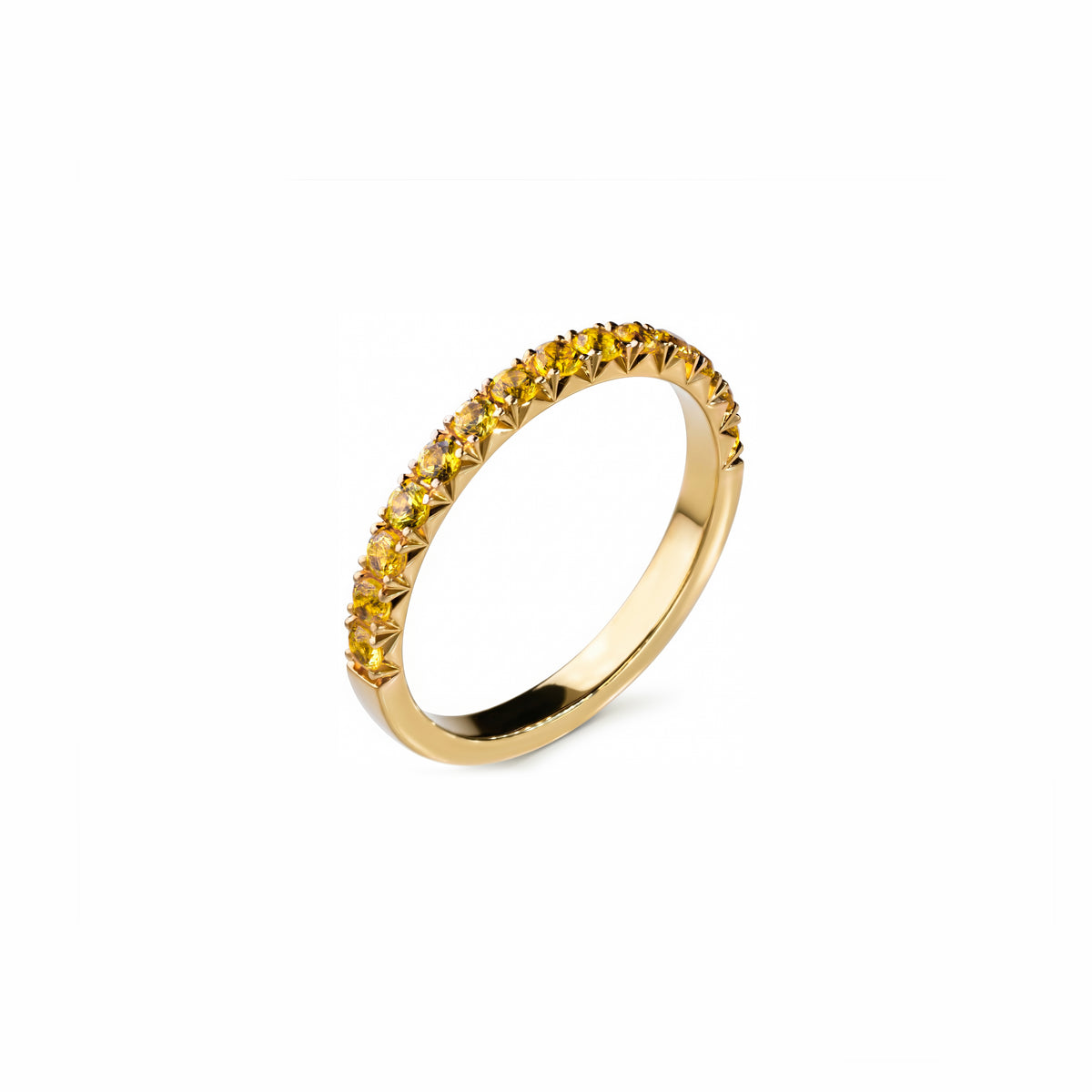 Yellow Sapphire Fishtail Ring: yellow gold fishtail ring with a row of yellow sapphires, angled view.