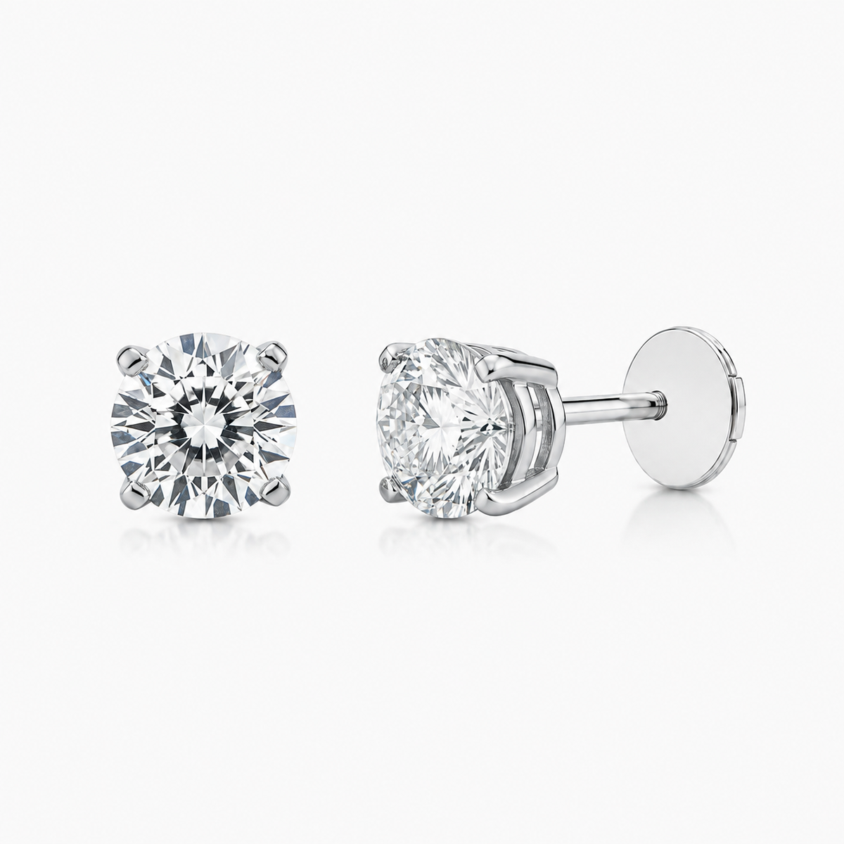 Round brilliant diamond stud earrings showing their posts and backs.