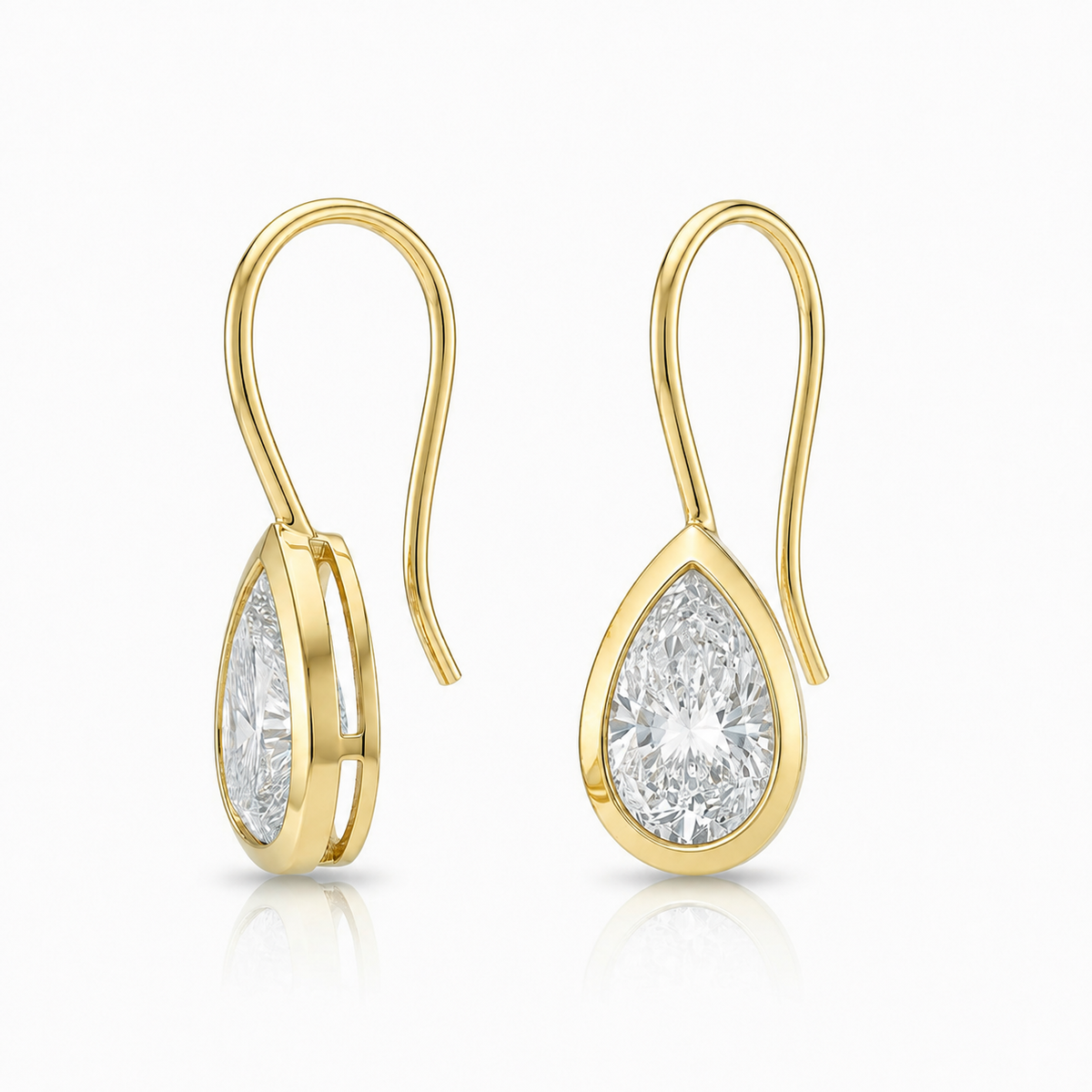 Pear-Cut Diamond Drop Earrings: angled view of pear-shaped diamond drop earrings with hook fastenings.