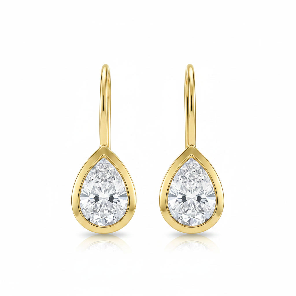 Pear-Cut Diamond Drop Earrings: pair of yellow gold pear-shaped diamond drop earrings, front view.