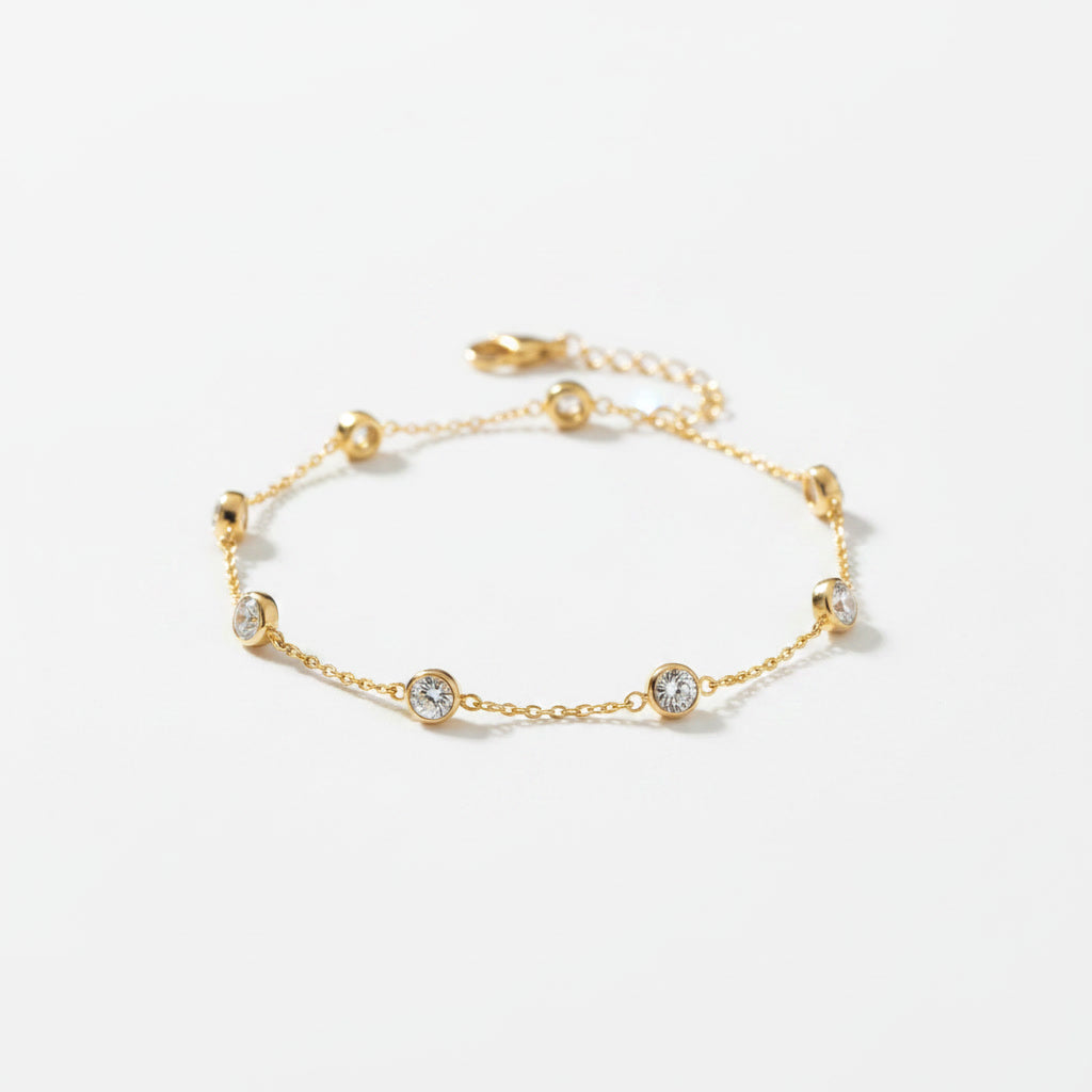 Diamond Station Chain Bracelet: yellow gold chain bracelet with spaced bezel-set diamond stations.