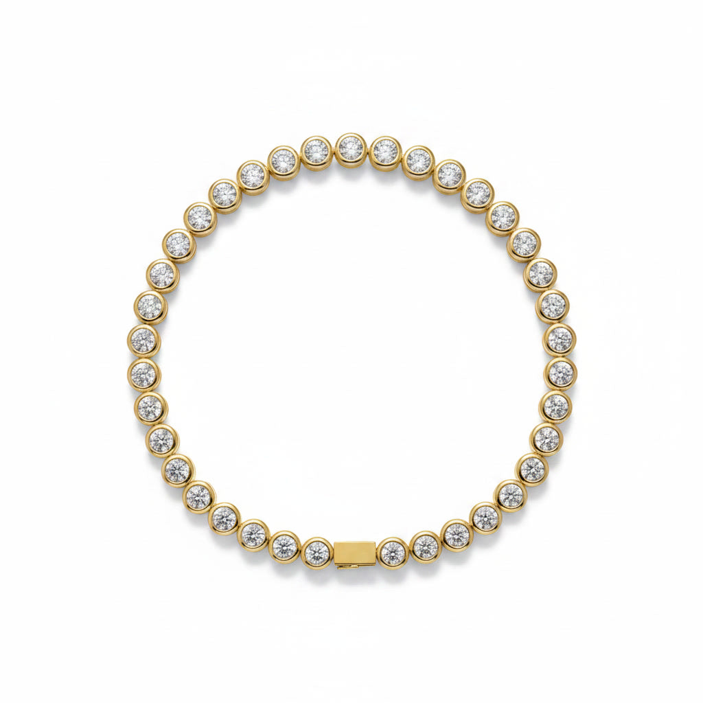 Bezel-Set Diamond Tennis Bracelet: yellow gold tennis bracelet with a continuous line of bezel-set diamonds.